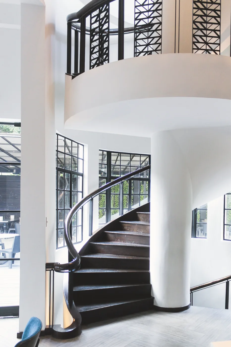 Actual photograph of the curved staircase inside Blackbird at the Nielson Tower